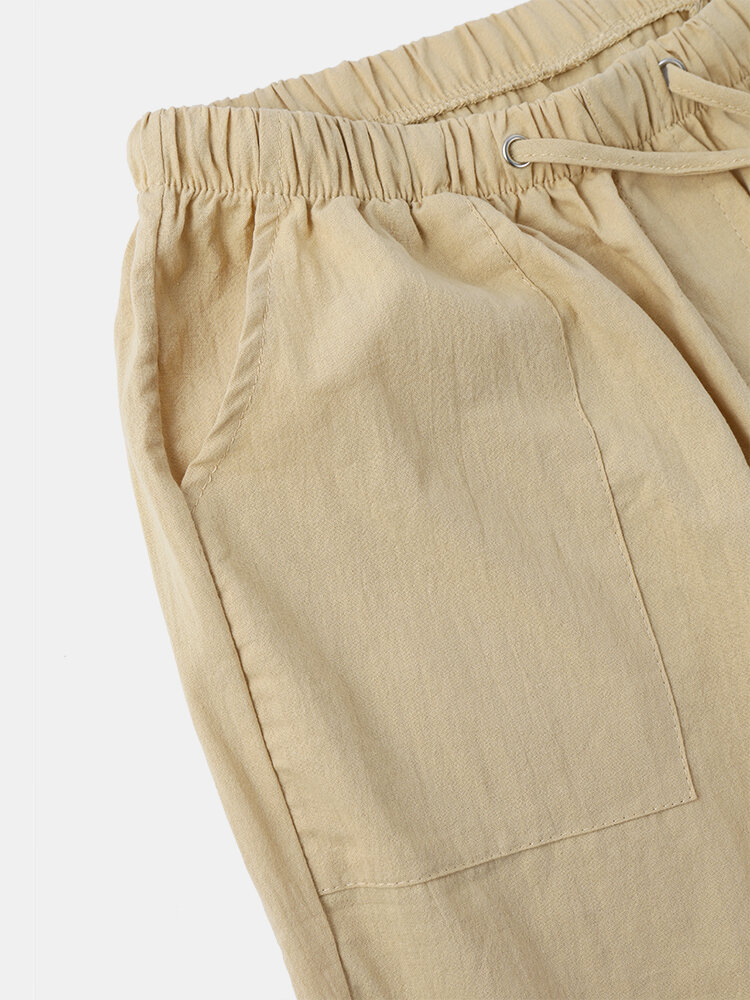 
	Men Solid Color Drawstring Pocket Casual Loose Straight Pants